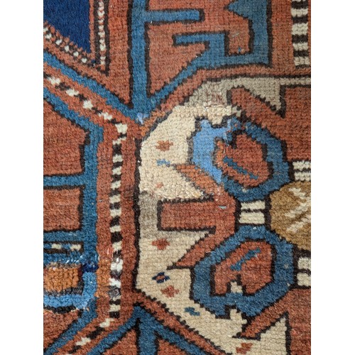 465 - A blue ground Persian rug, 193x124cm