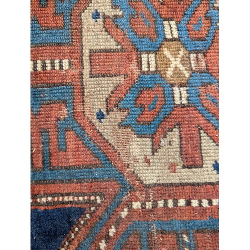 465 - A blue ground Persian rug, 193x124cm