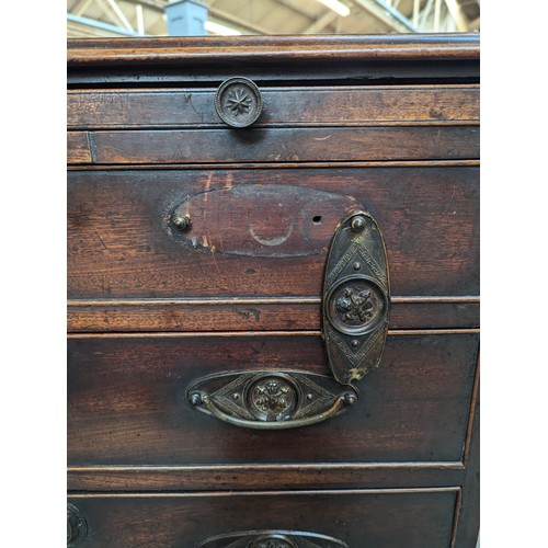 379 - A neat George III mahogany bachelor's chest, with brushing slide over four graduating drawers, on br... 