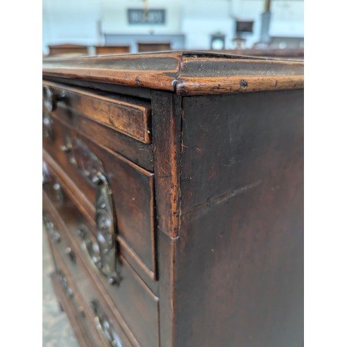 379 - A neat George III mahogany bachelor's chest, with brushing slide over four graduating drawers, on br... 