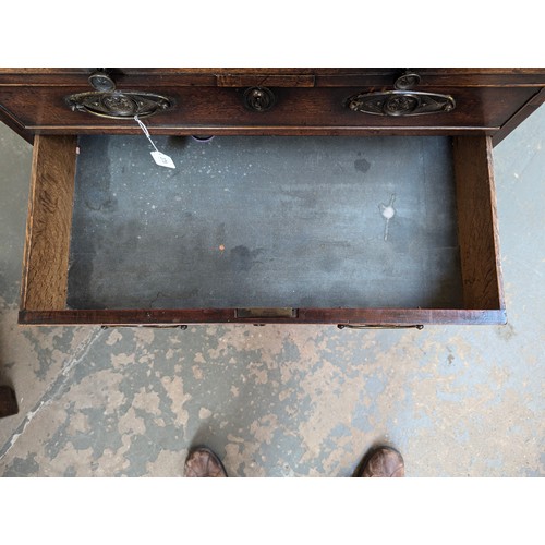 379 - A neat George III mahogany bachelor's chest, with brushing slide over four graduating drawers, on br... 