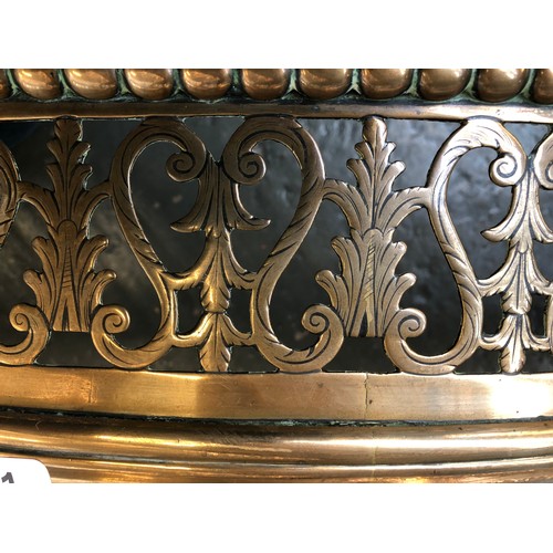 351 - A George III serpentine brass fender, c.1800, the pierced front with scroll and trailing bell flower... 