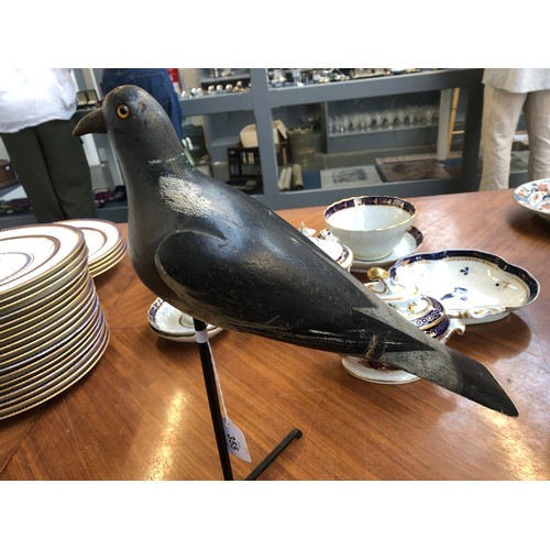 355 - A decoy pigeon, 19th century, carved and painted and mounted on a stand, approx. 38cm long

Provenan... 