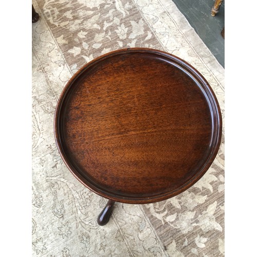 392 - A George III mahogany wine table, the circular dished top raised on a baluster turned column, and tr... 