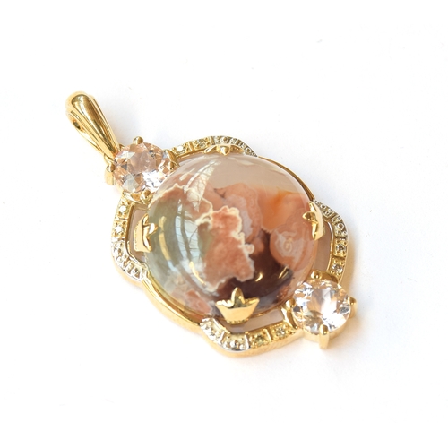 13 - A 9ct pendant set with an Aquaprase cabochon, 10.7cts, surrounded by morganite, 1.1cts and champagne... 