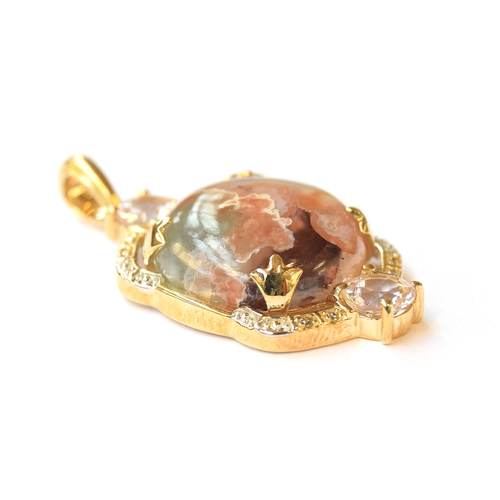 13 - A 9ct pendant set with an Aquaprase cabochon, 10.7cts, surrounded by morganite, 1.1cts and champagne... 