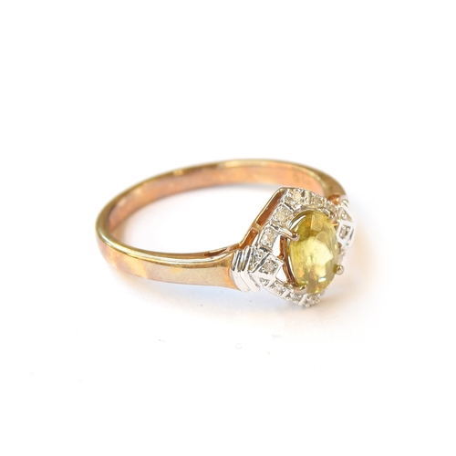 24 - A 9ct gold ring set with a Sambava sphene surrounded by diamonds, the Madagascan sphene 0.93cts, dia... 