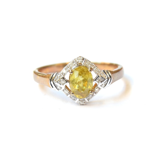 24 - A 9ct gold ring set with a Sambava sphene surrounded by diamonds, the Madagascan sphene 0.93cts, dia... 