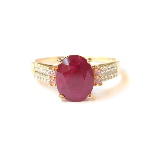 32 - A 9ct gold ring set with a ruby, pink sapphires and natural zircon, the Burmese ruby 3.2g, size Q, 2... 