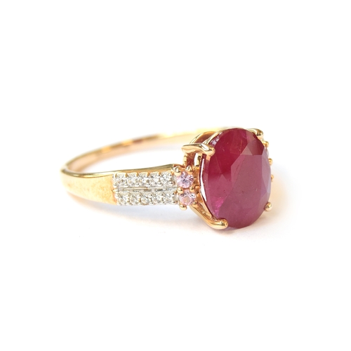 32 - A 9ct gold ring set with a ruby, pink sapphires and natural zircon, the Burmese ruby 3.2g, size Q, 2... 