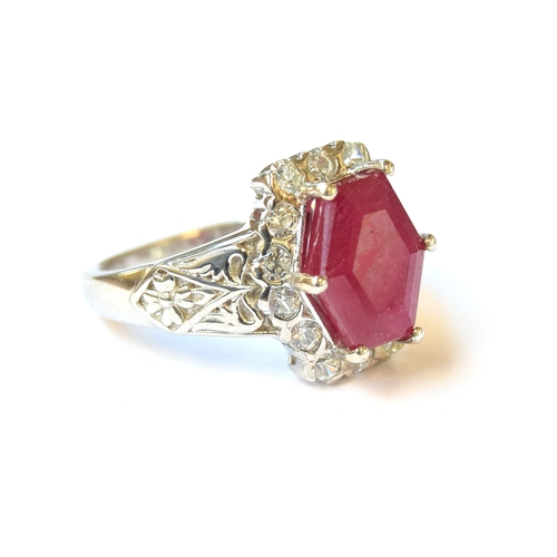 36 - A sterling silver ring set with a Cabo Delgado ruby, surrounded by natural zircons, the ruby 5.1cts,... 