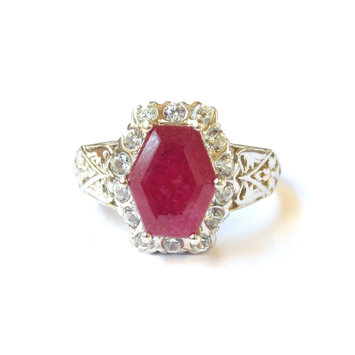 36 - A sterling silver ring set with a Cabo Delgado ruby, surrounded by natural zircons, the ruby 5.1cts,... 