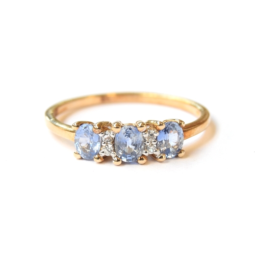 37 - A 9ct gold ring set with Ceylon sapphires and natural white zircons, the three oval sapphires totall... 