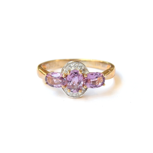 46 - A 10ct gold ring set with purple sapphires and natural white zircons, the sapphires totalling 1.54ct... 