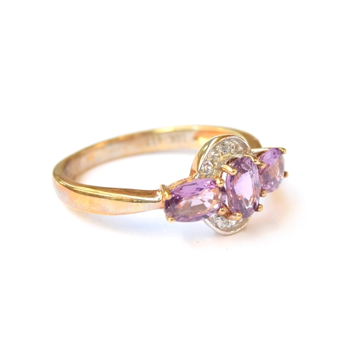 46 - A 10ct gold ring set with purple sapphires and natural white zircons, the sapphires totalling 1.54ct... 