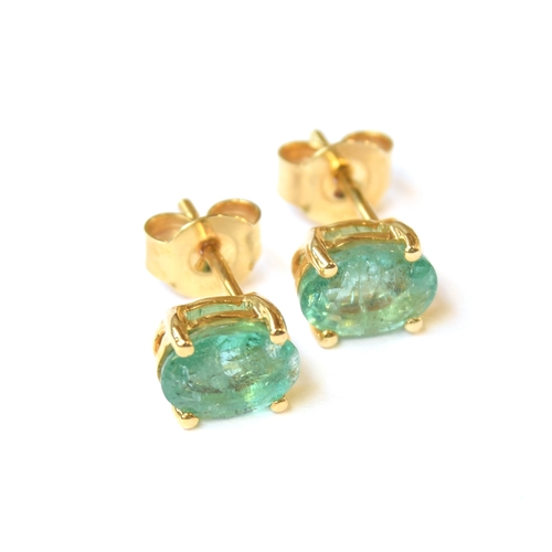 51 - A pair of 9ct gold Zambian emerald stud earrings, the emeralds totalling 1.4cts, gross weight 1.4g