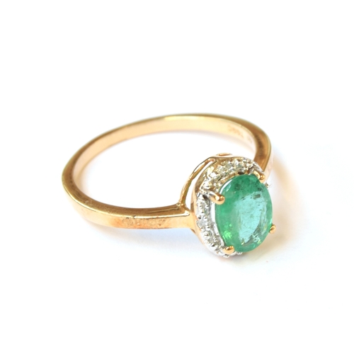 52 - A 9ct gold, emerald and diamond cluster ring, the Zambian emerald 1.1cts and 8x6mm, surrounded by 0.... 