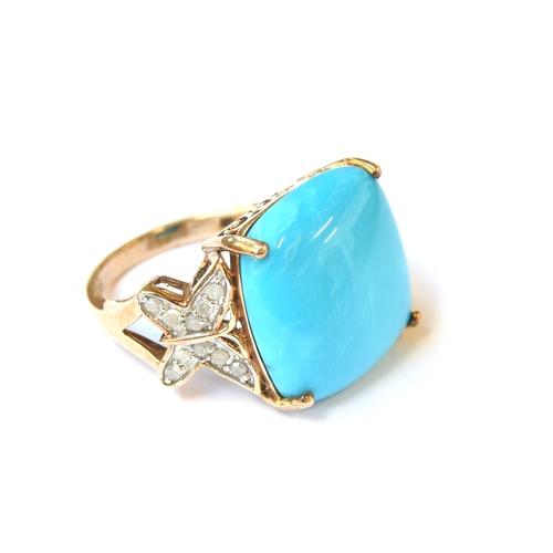 53 - A 9ct gold ring set with a a cushion cabochon of Sleeping Beauty turquoise, the butterfly shaped sho... 