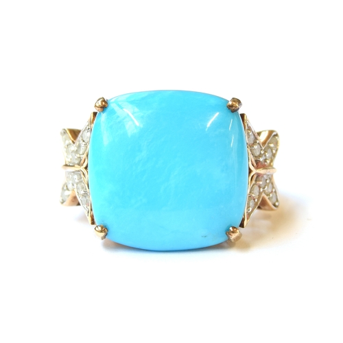 53 - A 9ct gold ring set with a a cushion cabochon of Sleeping Beauty turquoise, the butterfly shaped sho... 