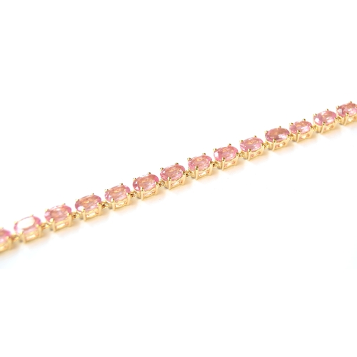 8 - A 10ct gold bracelet set with pink spinels, the Mozambique spinels totalling 8.44cts, 7.6g