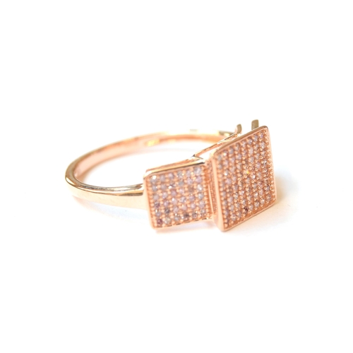 57 - A 9ct rose gold panel ring set with pink diamonds, the diamonds totalling 0.5cts, size P 1/2, 2.3g