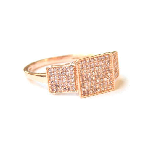 57 - A 9ct rose gold panel ring set with pink diamonds, the diamonds totalling 0.5cts, size P 1/2, 2.3g