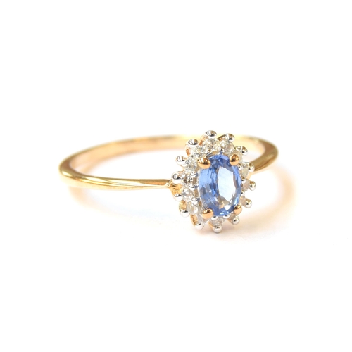 59 - A 9ct gold sapphire and white zircon cluster ring, the Ceylon sapphire 0.6cts, size S, 1.9g