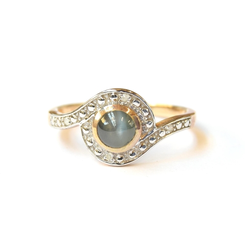 63 - A 9ct gold ring set with a cabochon cats eye alexandrite and illusion set diamonds, the alexandrite ... 