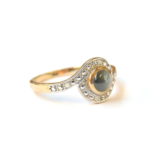 63 - A 9ct gold ring set with a cabochon cats eye alexandrite and illusion set diamonds, the alexandrite ... 