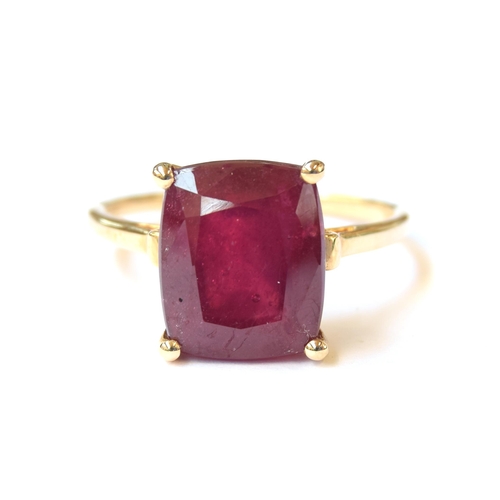 65 - A 10ct gold ring set with a large cushion cut Madagascan ruby, 9.2cts, size R 1/2, 4.4g