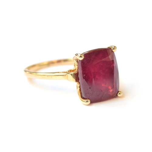 65 - A 10ct gold ring set with a large cushion cut Madagascan ruby, 9.2cts, size R 1/2, 4.4g