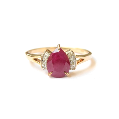 66 - A 9ct gold ring set with a pear shaped ruby flanked by diamonds, the Burmese ruby 1.9cts, size P 1/2... 