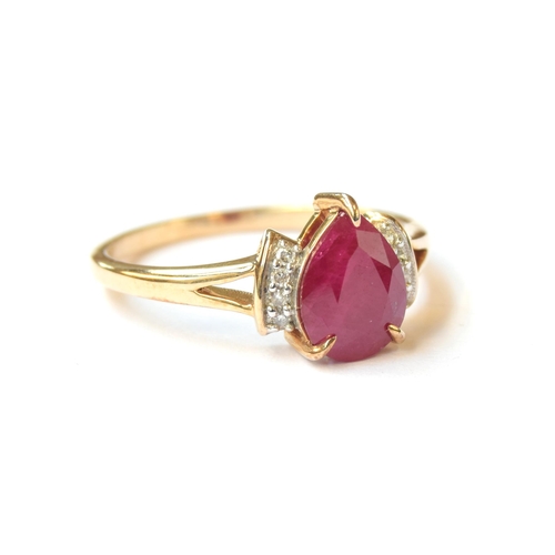 66 - A 9ct gold ring set with a pear shaped ruby flanked by diamonds, the Burmese ruby 1.9cts, size P 1/2... 