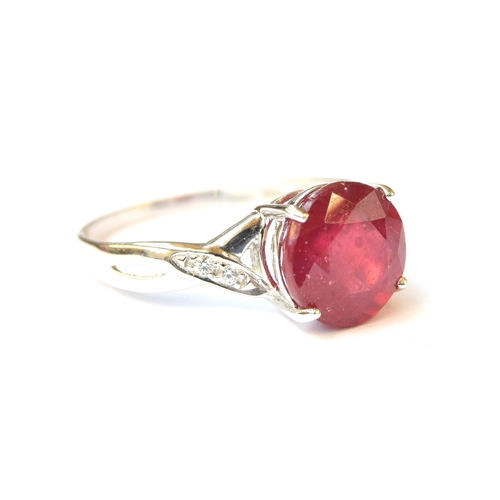 73 - A 9ct white gold ring set with a ruby and white zircons, the Madagascan ruby 5.6cts, size S, 3.4g