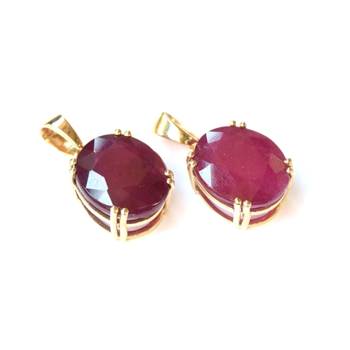 75 - Two 9ct gold and Madagascan ruby pendants, one set with an 11.76ct ruby, 3.5g; the other 11.33cts, 3... 