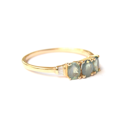 81 - A 9ct gold alexandrite and diamond trilogy ring, the Orissa alexandrite totalling 1.18cts, the taper... 