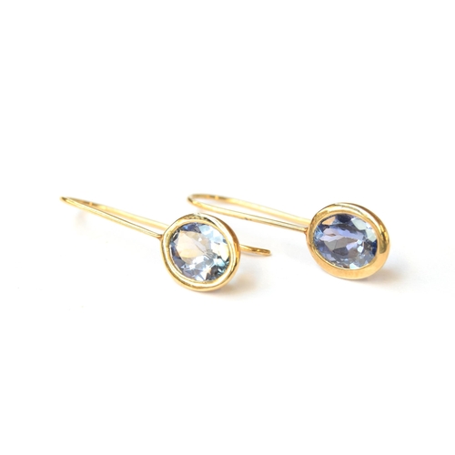 82 - A pair of 9ct gold bi-colour tanzanite hook earrings, the tanzanite totalling 2.76cts, 1.2g gross we... 