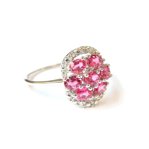 93 - A 9ct white gold cluster ring set with pink spinels and diamonds, the Tanzanian spinels totalling 1.... 