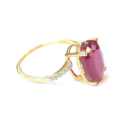 95 - A 9ct gold ring set with a ruby and white zircons, the Madagascan ruby 8.4cts and 14x10mm, size R 1/... 