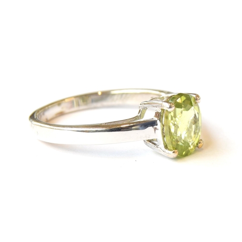 99 - A sterling silver and peridot ring, the Changbai peridot 1.8cts and 8.5x6.5mm, size P 1/2, 2.7g