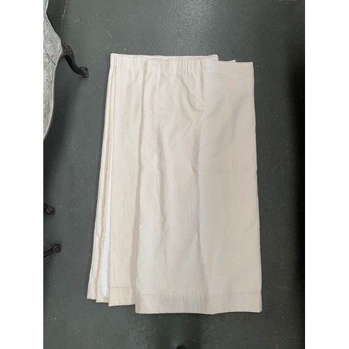 636 - A pair of cream wool and silk blend curtains, lined, each 151x278cm