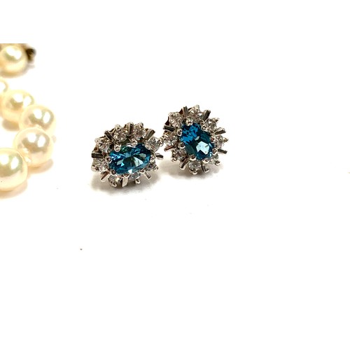 10A - A pair of 9ct gold, diamond and blue topaz cluster stud earrings, 2.3g gross weight together with A ... 