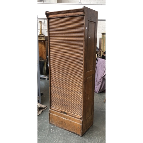 627 - 'The Globe Ideal Cabinet File' a large tambour fronted filing cabinet of drawers (locked), 70x45x198... 