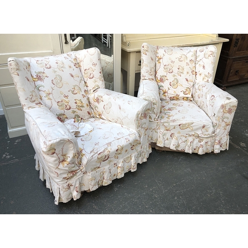 638 - A pair of country house wingback armchairs