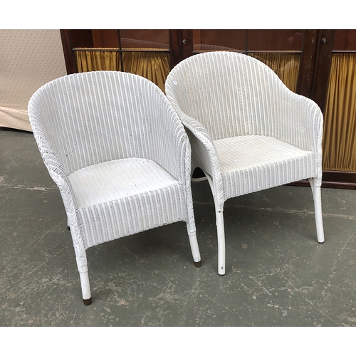 641 - A pair of white painted Lloyd Loom style armchairs