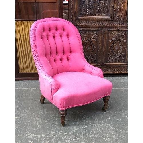 700 - A bright pink button upholstered Victorian bedroom chair, on turned legs with brass caps and casters