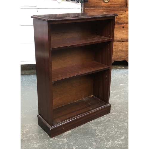 711 - A small mahogany bookcase, with two drawers over shelves, 79cmW; together with one other with two ad... 