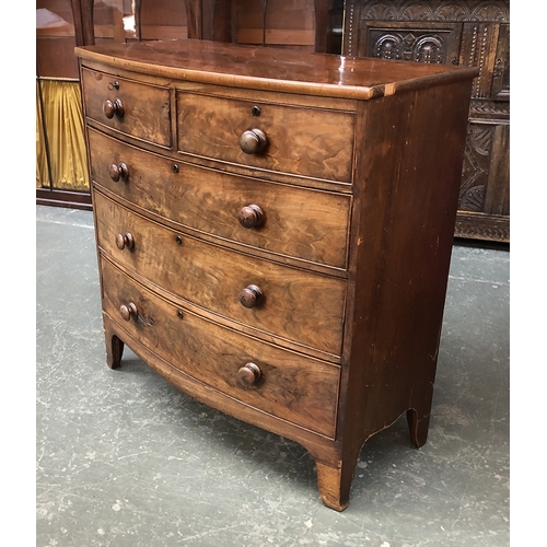 715 - A Regency bowfront mahogany chest two short over three long drawers, on bracket feet (some veneer li... 