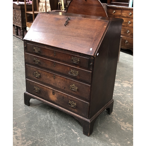 731 - An 18th century oak bureau, fall front with fitted interior, four drawers, on bracket feet, 92cmW