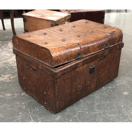 736 - A canvas and wood banded travel trunk; together with two large metal travel trunks, the larger 90cmW